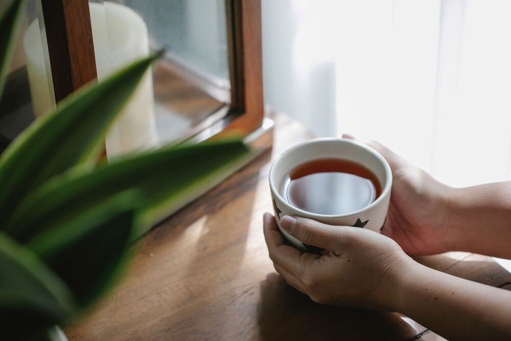 A warm mug of herbal tea on a table